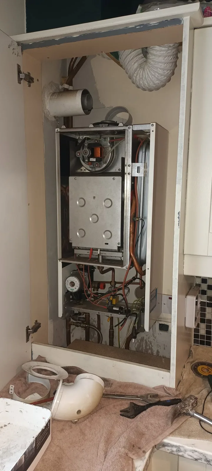 Old gas boiler opened up before removal